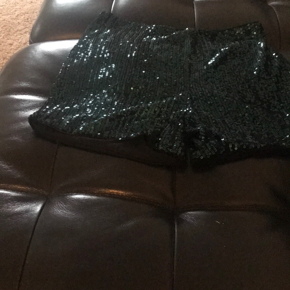 Size medium dark green sequence shorts.